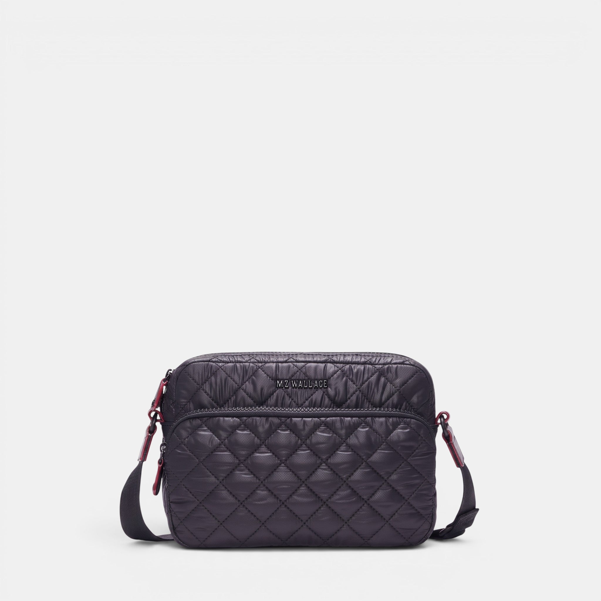 Shop Rescue Spa MZ Wallace black quilted nylon camera crossbody bag with leather trim and adjustable strap.
