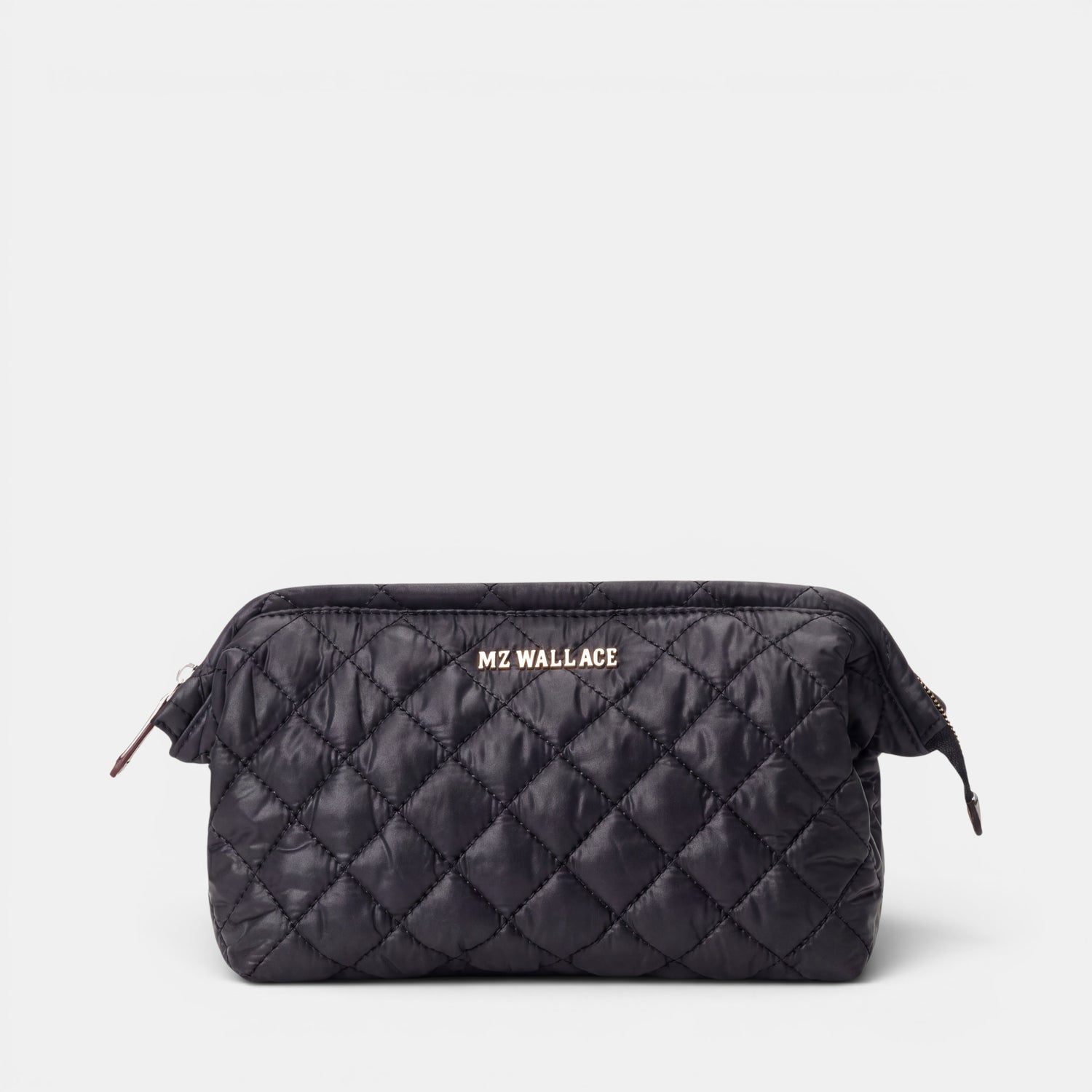Shop Rescue Spa Crosby Frame cosmetic bag in black quilted REC Oxford fabric with silver hardware and leather trim.