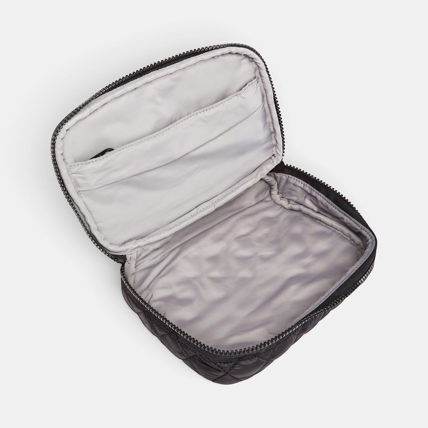 Shop Rescue Spa black quilted Zip Round Organizer with an open wraparound zipper and light grey wipeable interior.