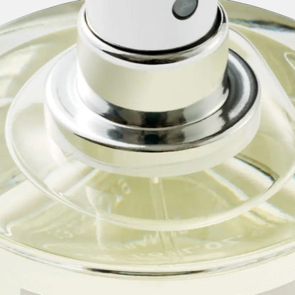 Shop Rescue Spa Black Saffron Eau De Parfum, a clear liquid in a glass bottle with a silver spray nozzle.