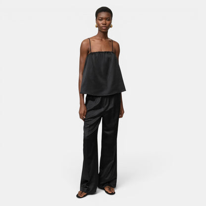 Shop Rescue Spa black woven silk blend straight leg pants with elastic waist and relaxed fit.