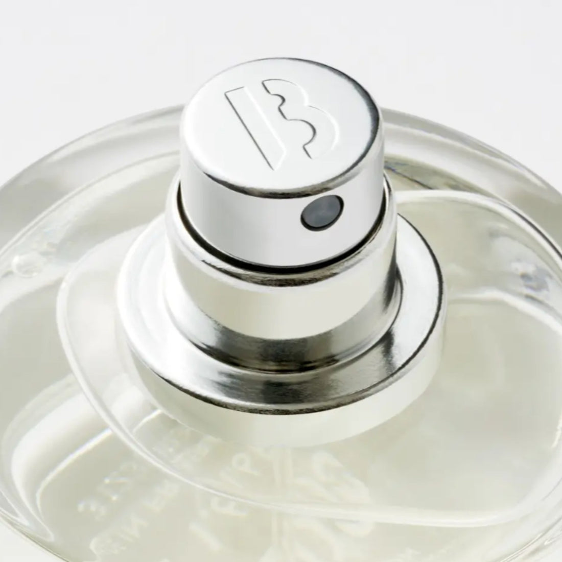 Shop Rescue Spa Blanche Eau De Parfum, clear glass bottle with silver spray top featuring a subtle B logo. Notes of aldehyde, rose, peony, musk.