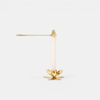 Shop Rescue Spa brass taper candle snuffer with a flower-shaped base and a long handle.