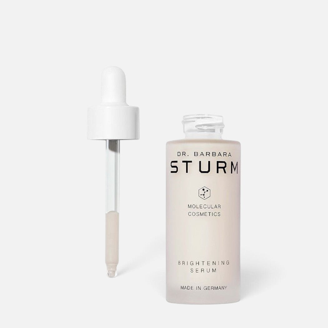 Shop Rescue Spa Dr. Barbara Sturm Brightening Serum in a glass bottle with a white dropper against a white background.