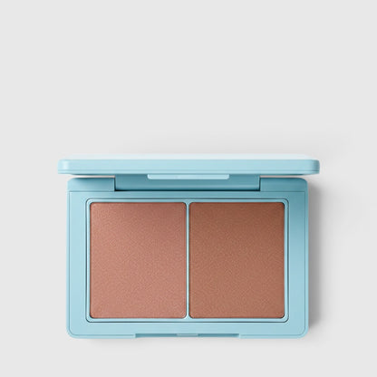 Shop Rescue Spa Sun Tone Bronzing Crème duo in a light blue compact with two complementary tan shades.