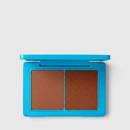 Shop Rescue Spa Sun Tone Bronzing Crème duo in a bright blue compact with two complementary tan bronzer shades.