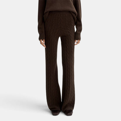 Shop Rescue Spa dark brown cable knit cashmere pants with an elastic waist, shown in a regular fit on a model.