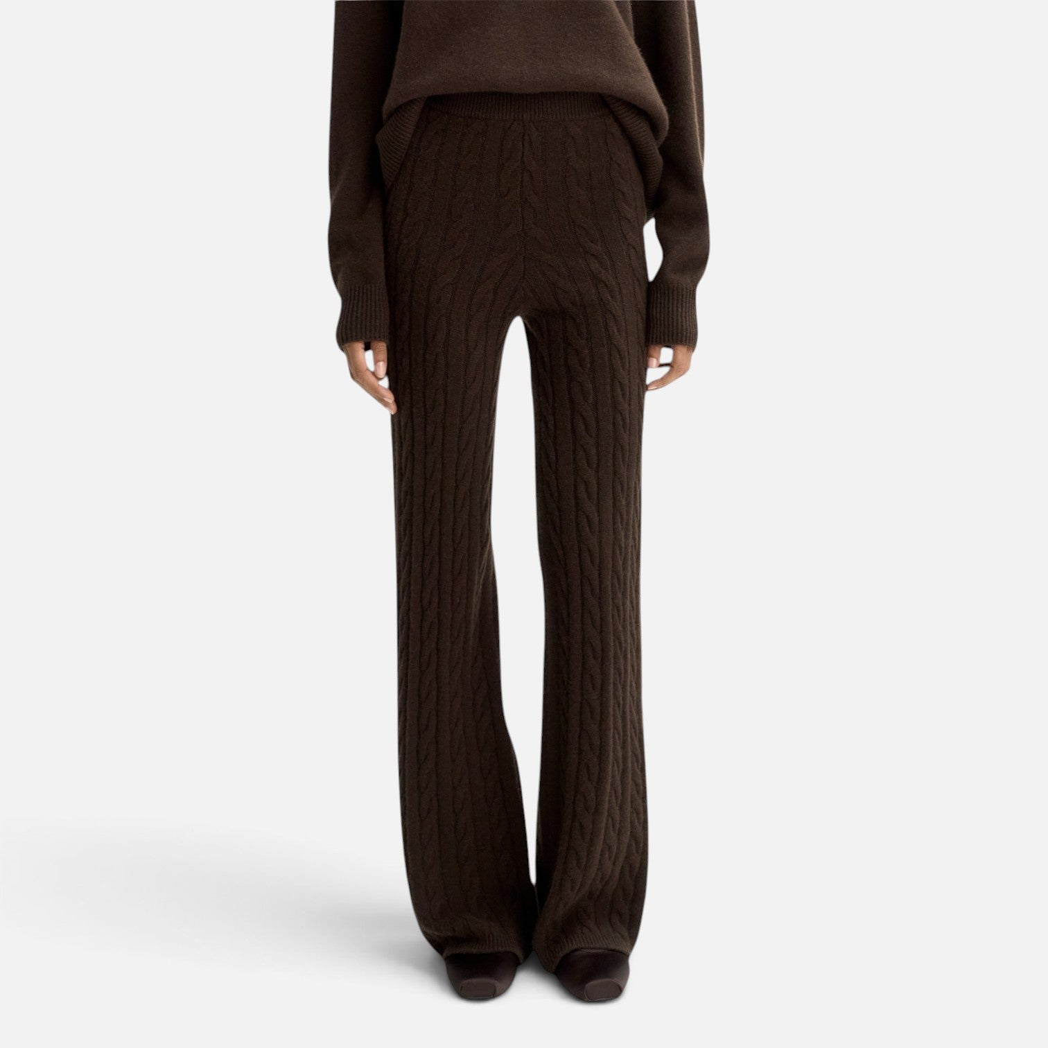 Shop Rescue Spa dark brown cable knit cashmere pants with an elastic waist and regular fit on a model