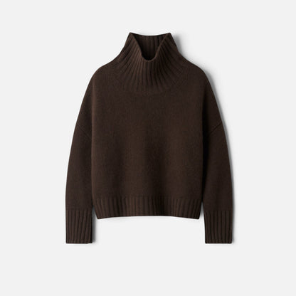 Shop Rescue Spa Girlfriend Turtleneck in dark brown 100% cashmere with a chunky knit and sleeve slits.