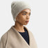 Shop Rescue Spa brushed cashmere beanie in light grey worn by a model in a neutral coat