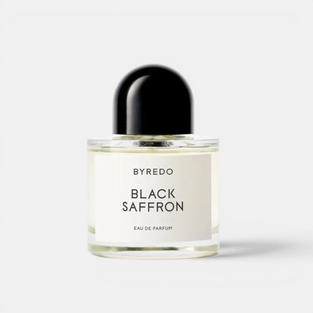 Shop Rescue Spa BYREDO Black Saffron Eau De Parfum bottle with black cap. Notes of juniper, saffron, rose, violet, raspberry, and vetiver.