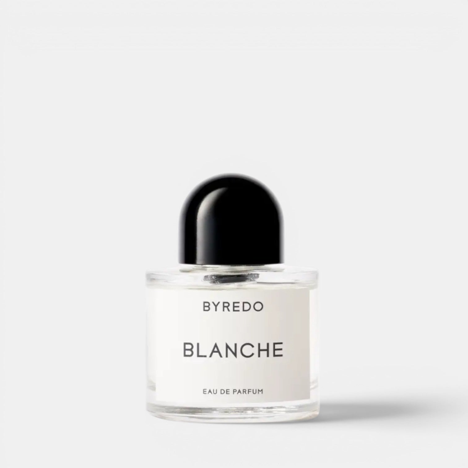 Shop Rescue Spa Byredo Blanche Eau de Parfum bottle with a black cap. Notes of aldehyde, pink pepper, white rose, neroli, peony, violet, blonde woods, musk, and sandalwood.