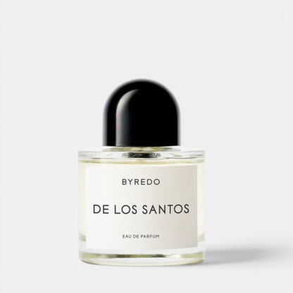 Shop Rescue Spa BYREDO De Los Santos Eau de Parfum bottle with black cap. Aromatic musk, sage, amber, incense, iris root, mirabelle, cistus notes.