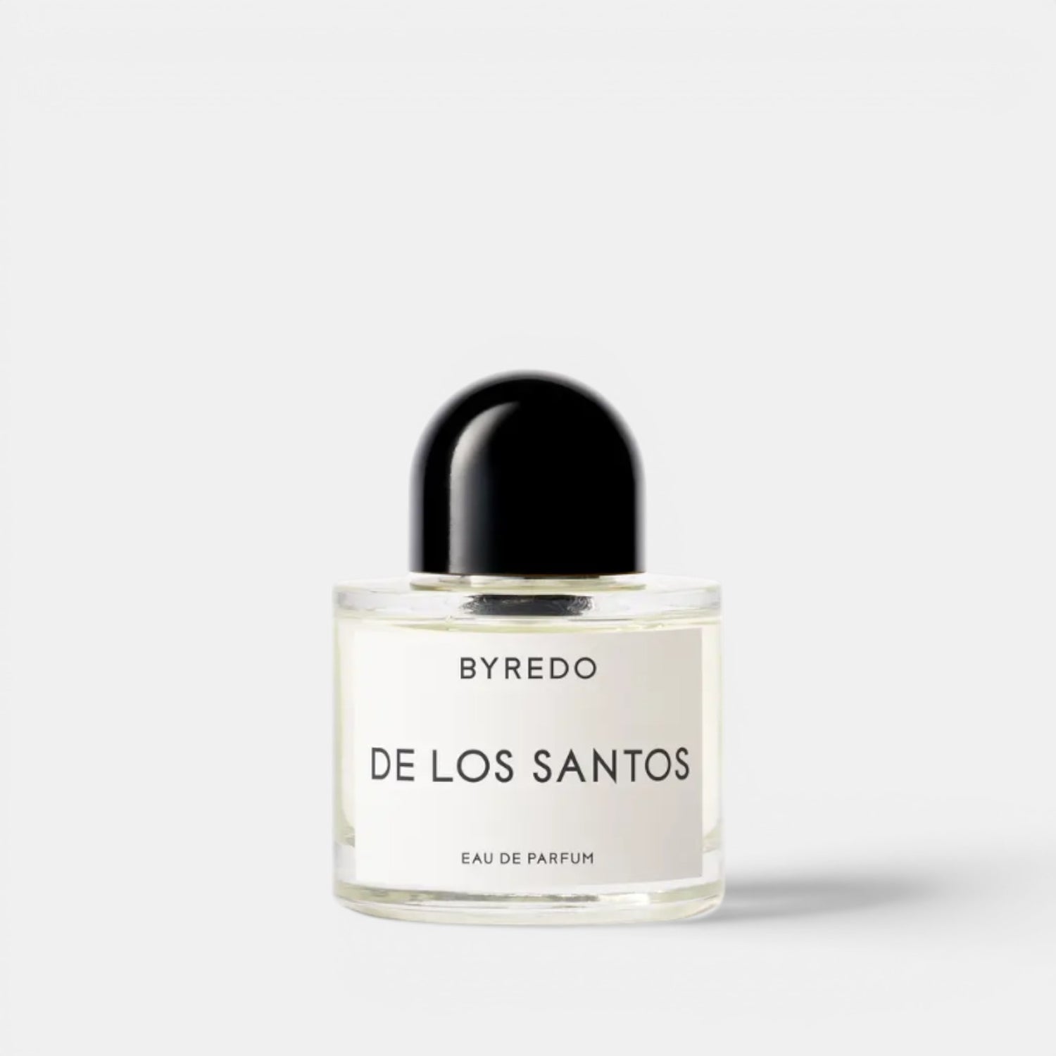 Shop Rescue Spa BYREDO De Los Santos Eau de Parfum bottle with black cap. Aromatic musk, sage, amber, incense, iris root, mirabelle, and cistus notes.