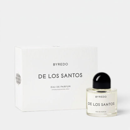 Shop Rescue Spa BYREDO De Los Santos Eau De Parfum bottle and box. Aromatic musk, sage, amber, incense, iris root, mirabelle, and cistus notes.
