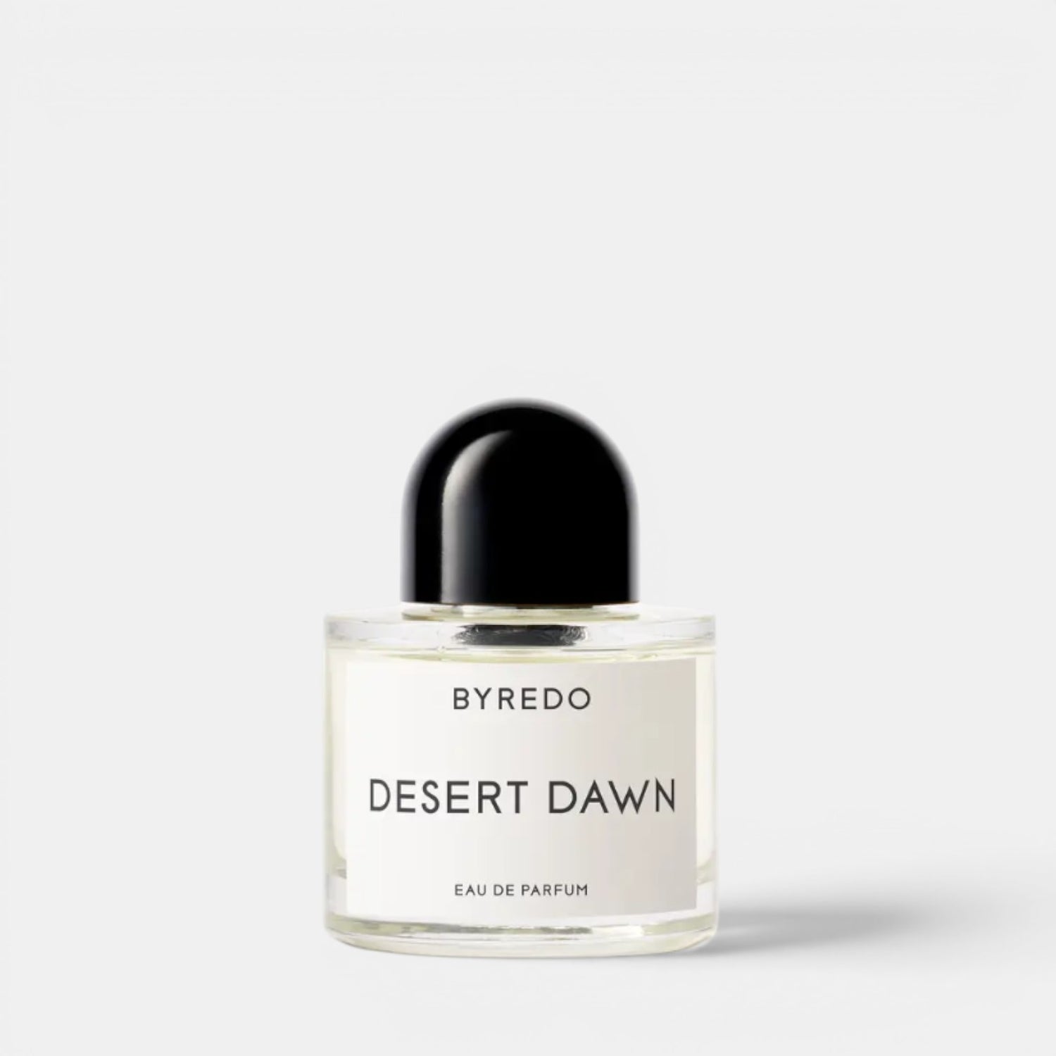 Shop Rescue Spa Byredo Desert Dawn Eau de Parfum, a clear glass bottle with a black cap, featuring a white label with black text.