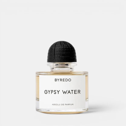 Shop Rescue Spa Byredo Gypsy Water Absolu de Parfum, a woody, spicy, amber fragrance in a clear glass bottle with a black wooden cap.