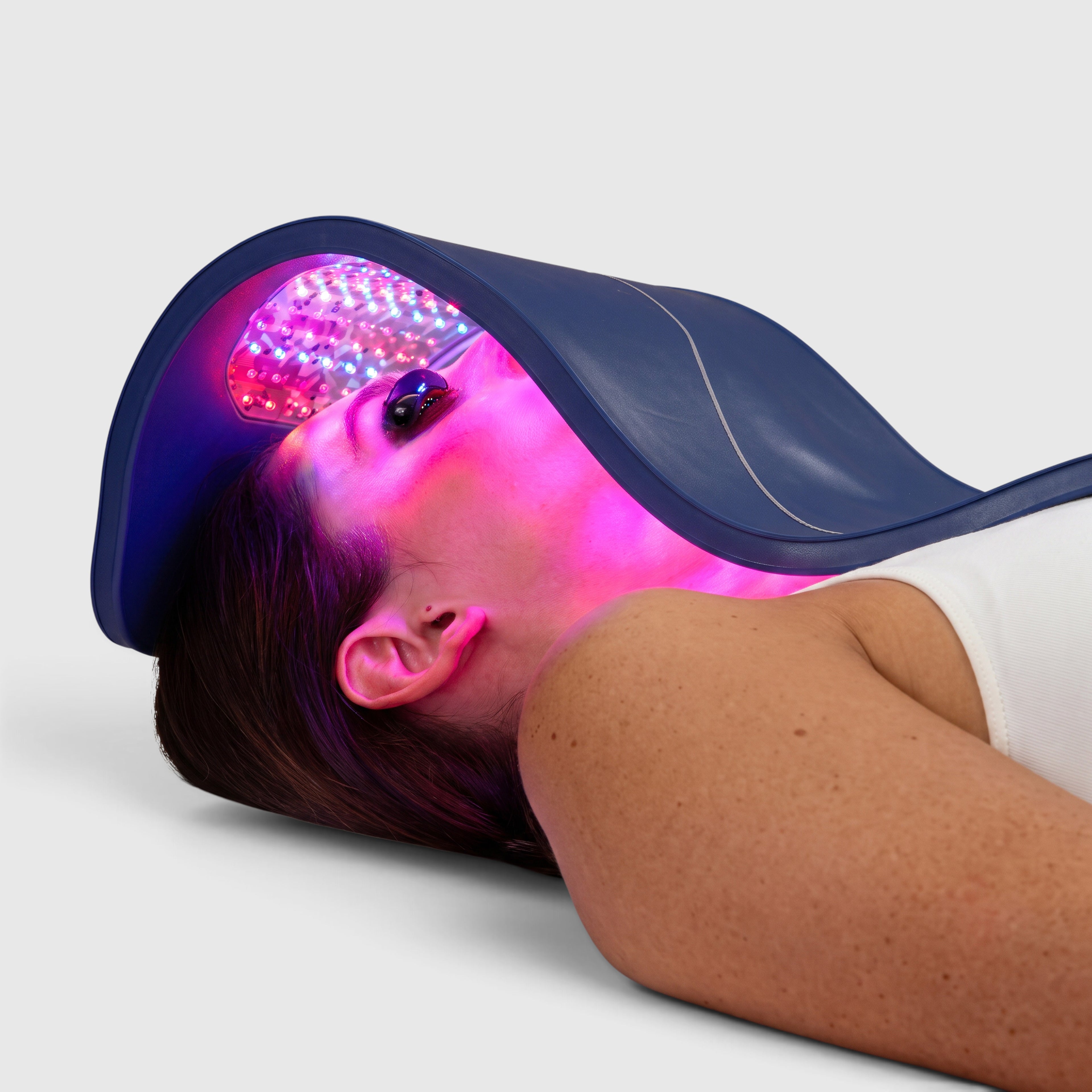 Shop Rescue Spa Celluma Pro LED light therapy panel emitting red and blue light over a woman&