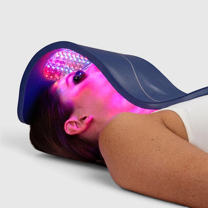 Shop Rescue Spa Celluma Pro LED light therapy panel emitting red and blue light over a woman&