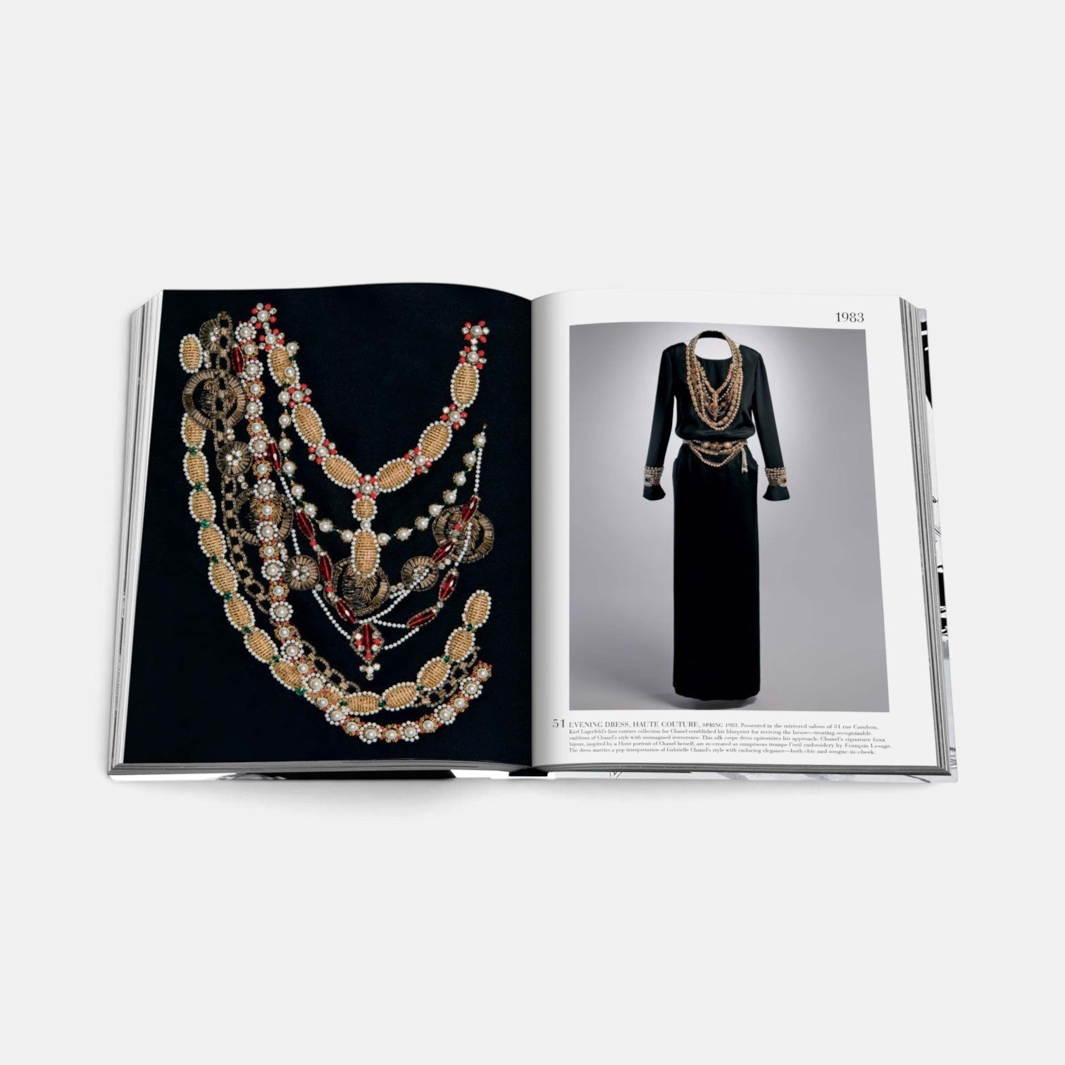 Shop Rescue Spa Chanel The Legend of an Icon book open to a page showing vintage Chanel jewelry and a black evening dress