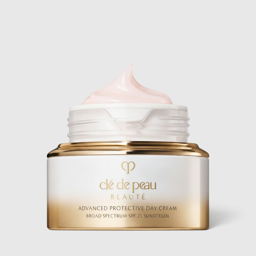 Shop Rescue Spa Cle de Peau Beaute Advanced Protective Day Cream SPF 25 in a luxury white and gold jar with cream.
