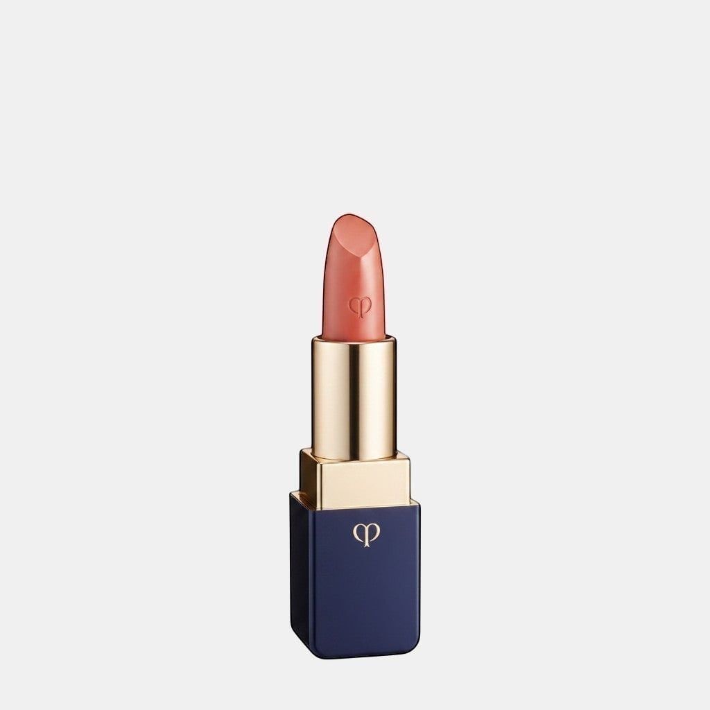 Shop Rescue Spa luxurious satin lipstick in a warm coral shade with a lustrous finish and gold accents.