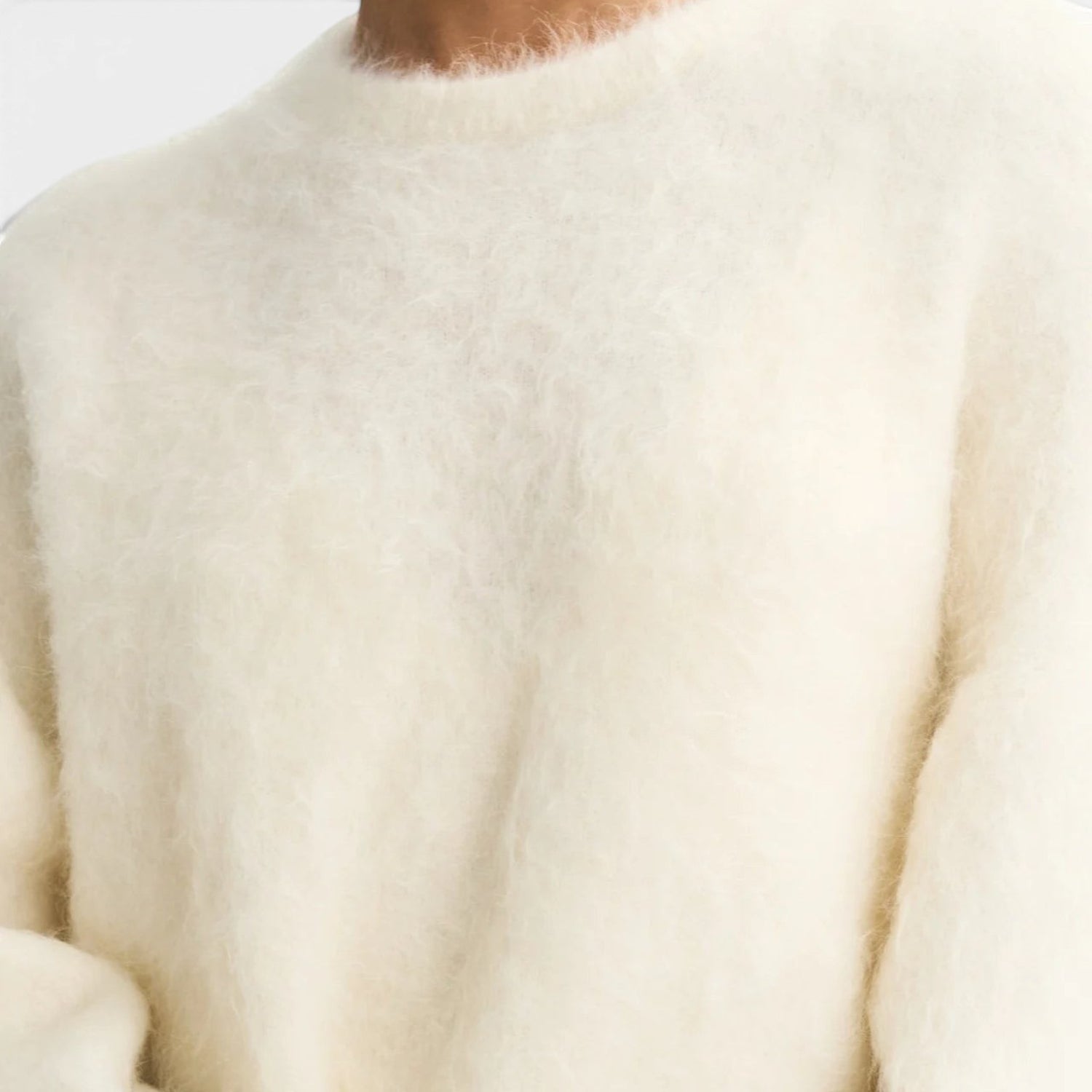 Shop Rescue Spa cream alpaca blend crewneck sweater with a soft fuzzy knit texture and relaxed fit.