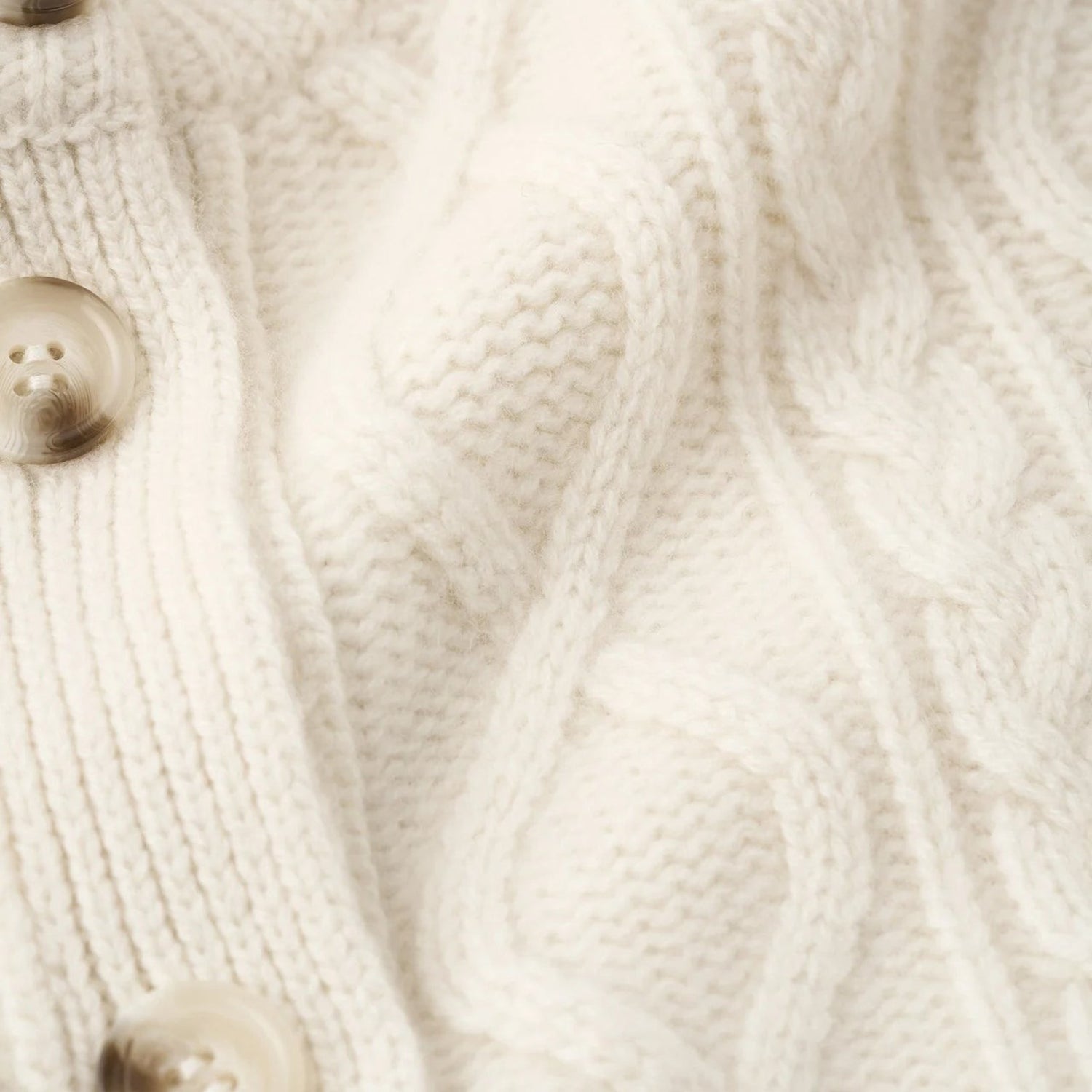 Shop Rescue Spa cream cable knit cashmere cardigan with detailed button placket and soft texture