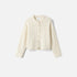 Shop Rescue Spa cream cable knit cardigan in 100% cashmere with a relaxed fit and button-down front.