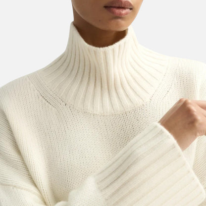 Shop Rescue Spa cream chunky knit cashmere turtleneck sweater with ribbed collar and sleeve slits