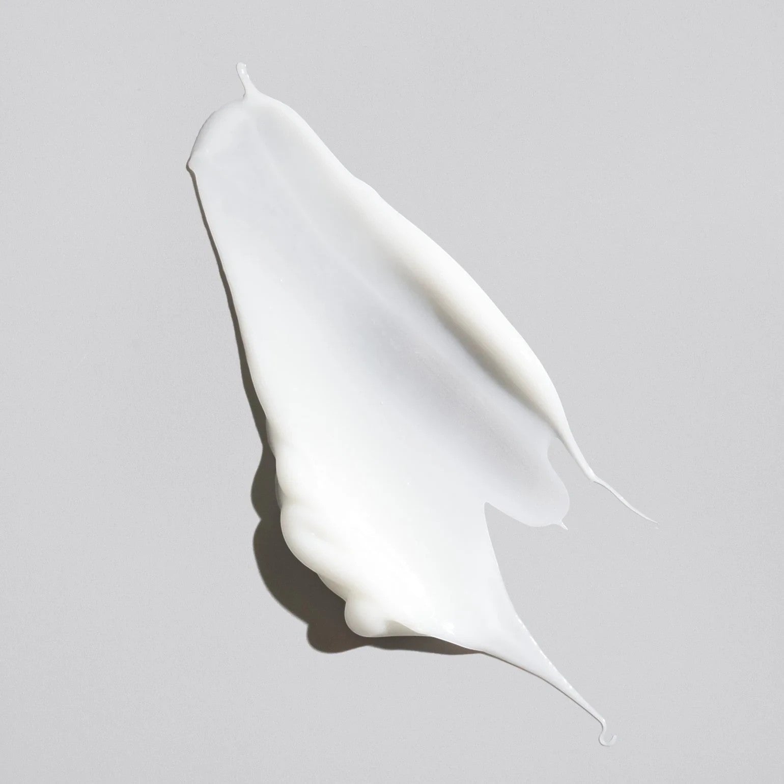 Shop Rescue Spa Creme for Style hair styling cream texture swatch showing a smooth white moisturizing formula