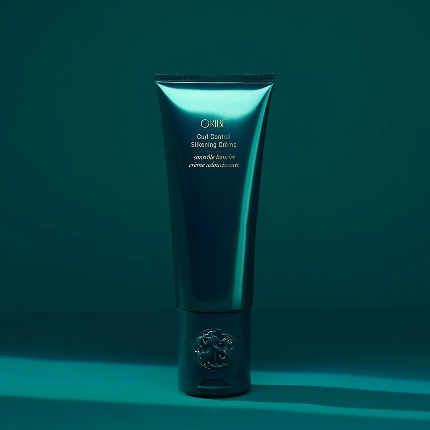 Shop Rescue Spa Oribe Curl Control Silkening Creme for defining curls with avocado, apricot, and coconut oils.