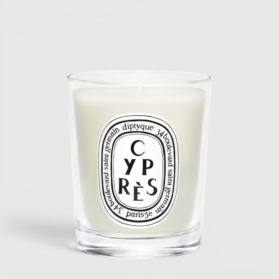 Shop Rescue Spa Cypres candle in a clear glass jar with a white wax finish and signature oval label
