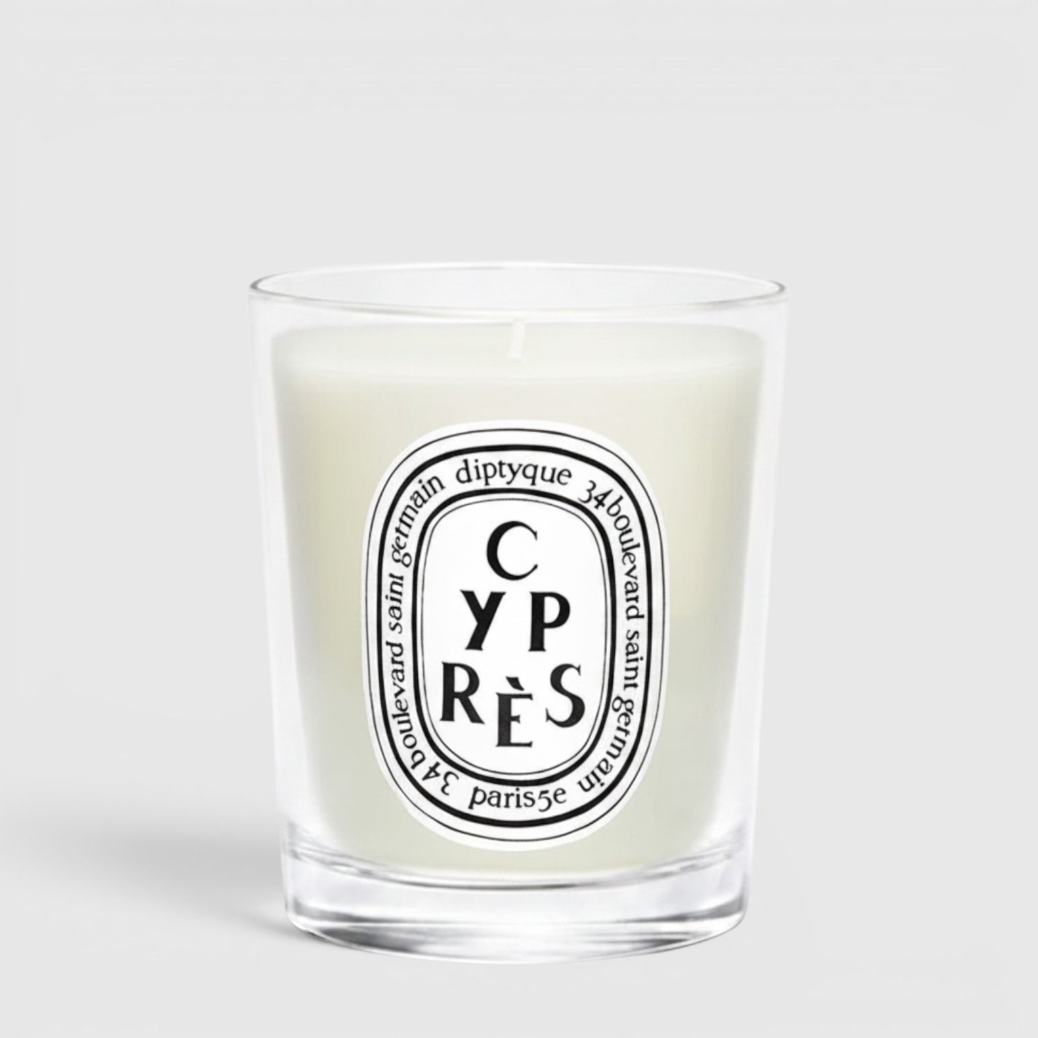 Shop Rescue Spa Cypres candle in a clear glass jar with a white wax finish and signature oval label