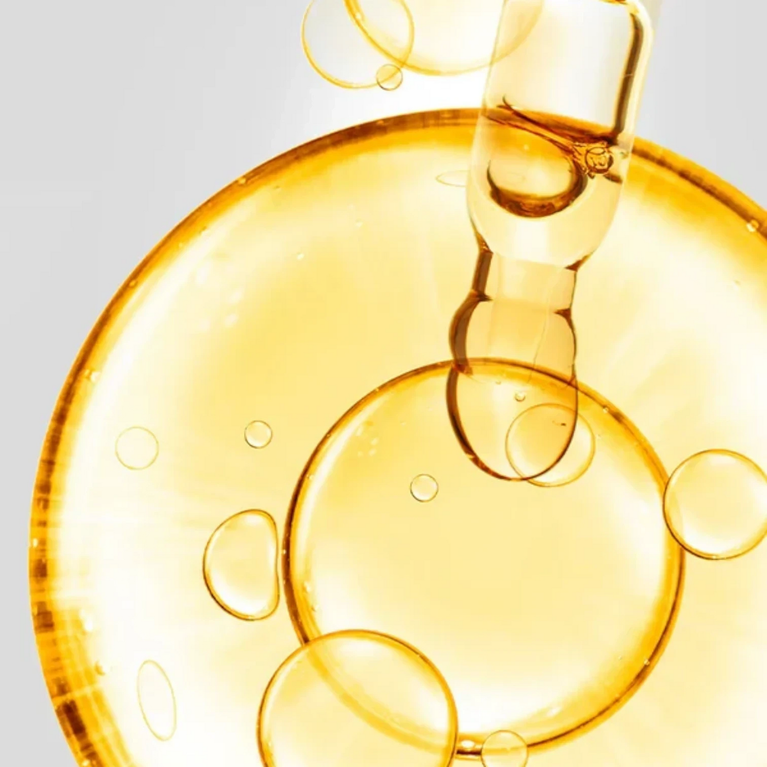 Shop Rescue Spa D7 Serum featuring a golden, vitamin-rich elixir with a dropper, creating a radiant, dewy skin effect.