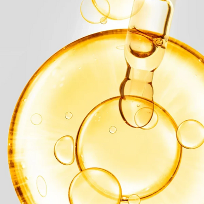 Shop Rescue Spa D7 Serum featuring a golden, vitamin-rich elixir with a dropper, creating a radiant, dewy skin effect.