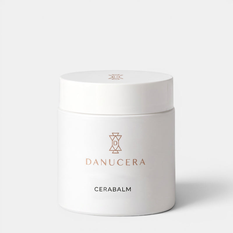 Shop Rescue Spa Danucera Cerabalm multi-purpose cleansing balm in a white jar with rose gold logo branding.