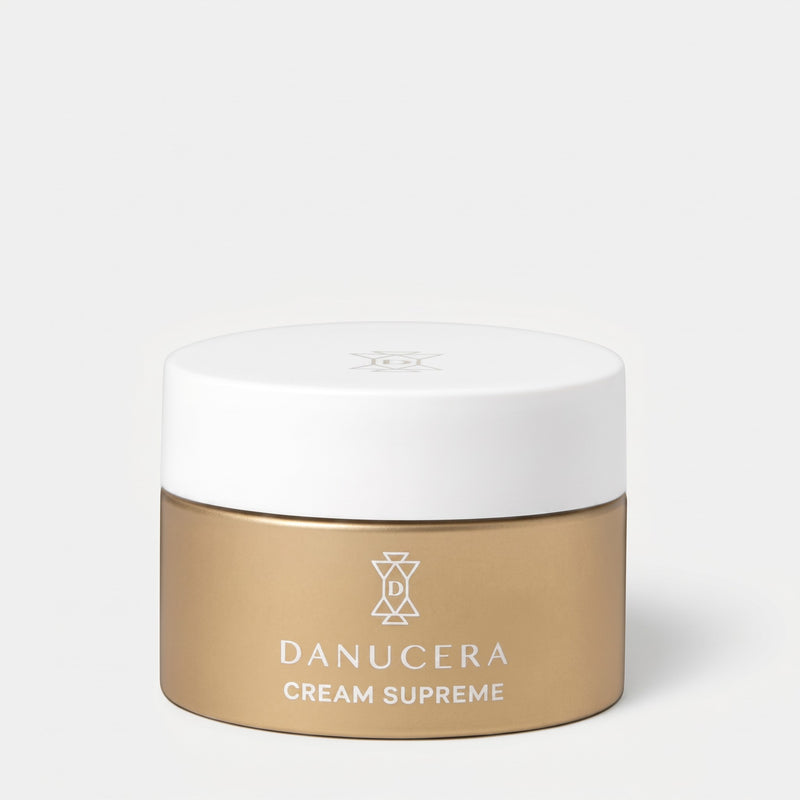 Shop Rescue Spa Danucera Cream Supreme moisturizer in a gold jar with a white lid on a neutral background.