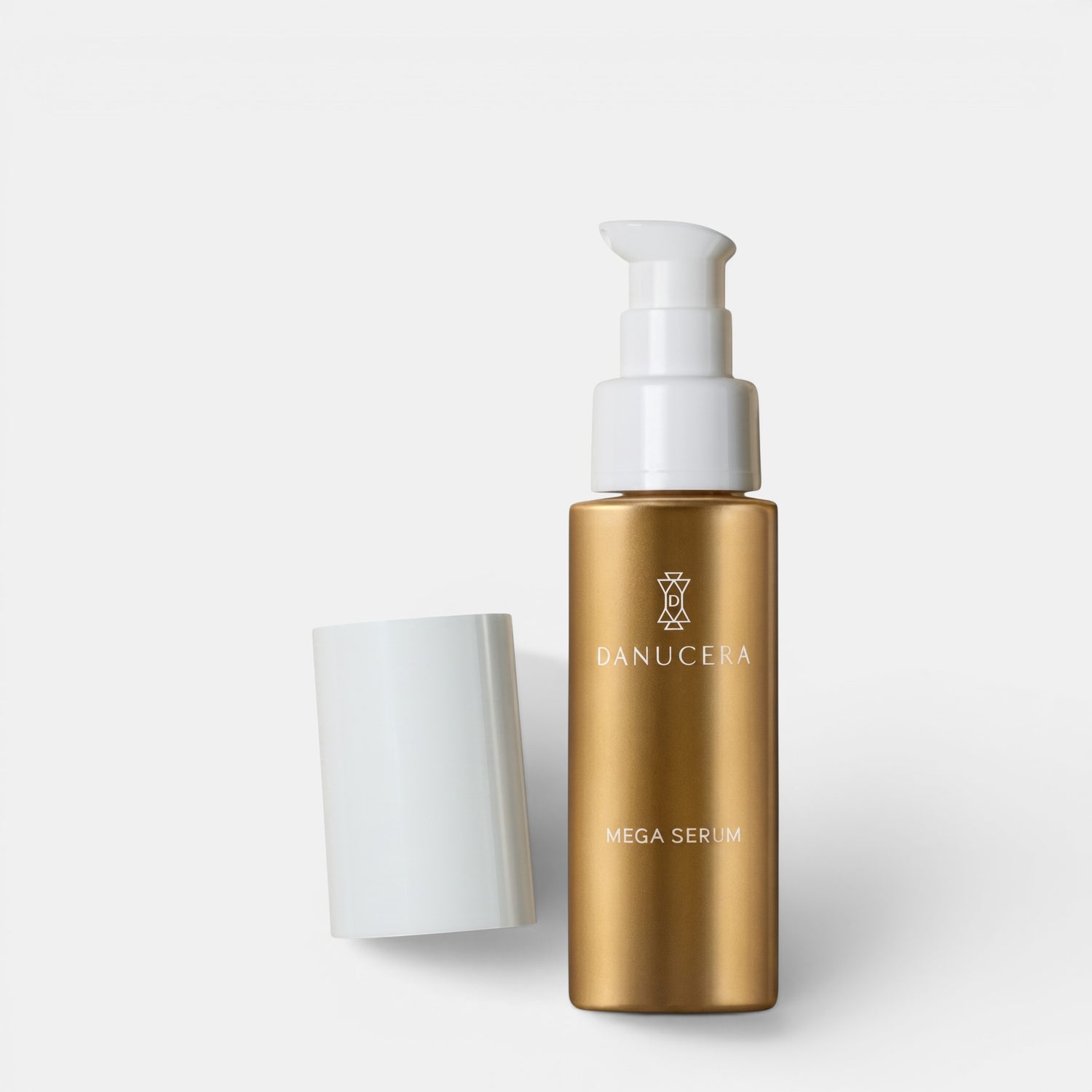 Shop Rescue Spa Danucera Mega Serum in a gold bottle with a white pump and cap against a white background.