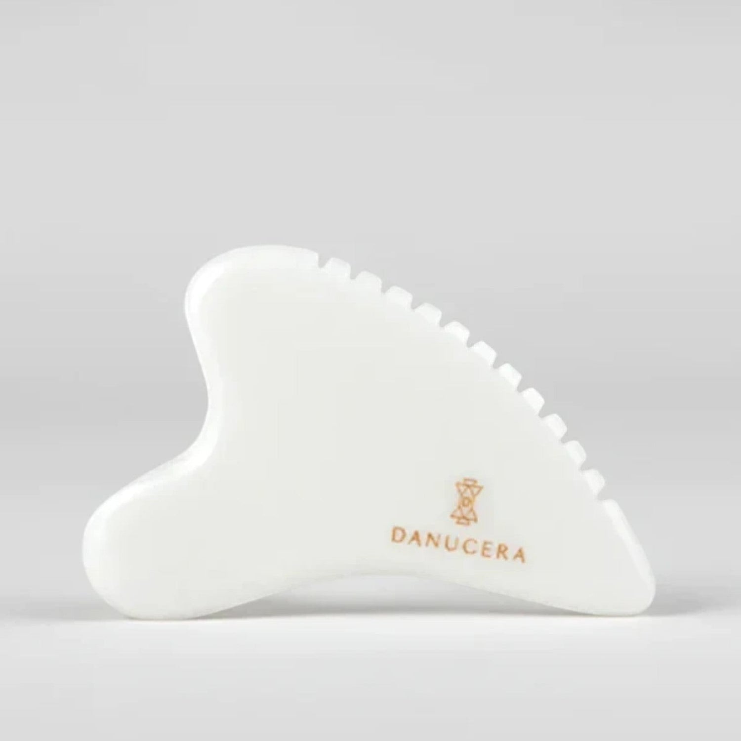 Shop Rescue Spa DANUCERA Sculpting Stone made of white jade for facial massage, lifting, and toning.