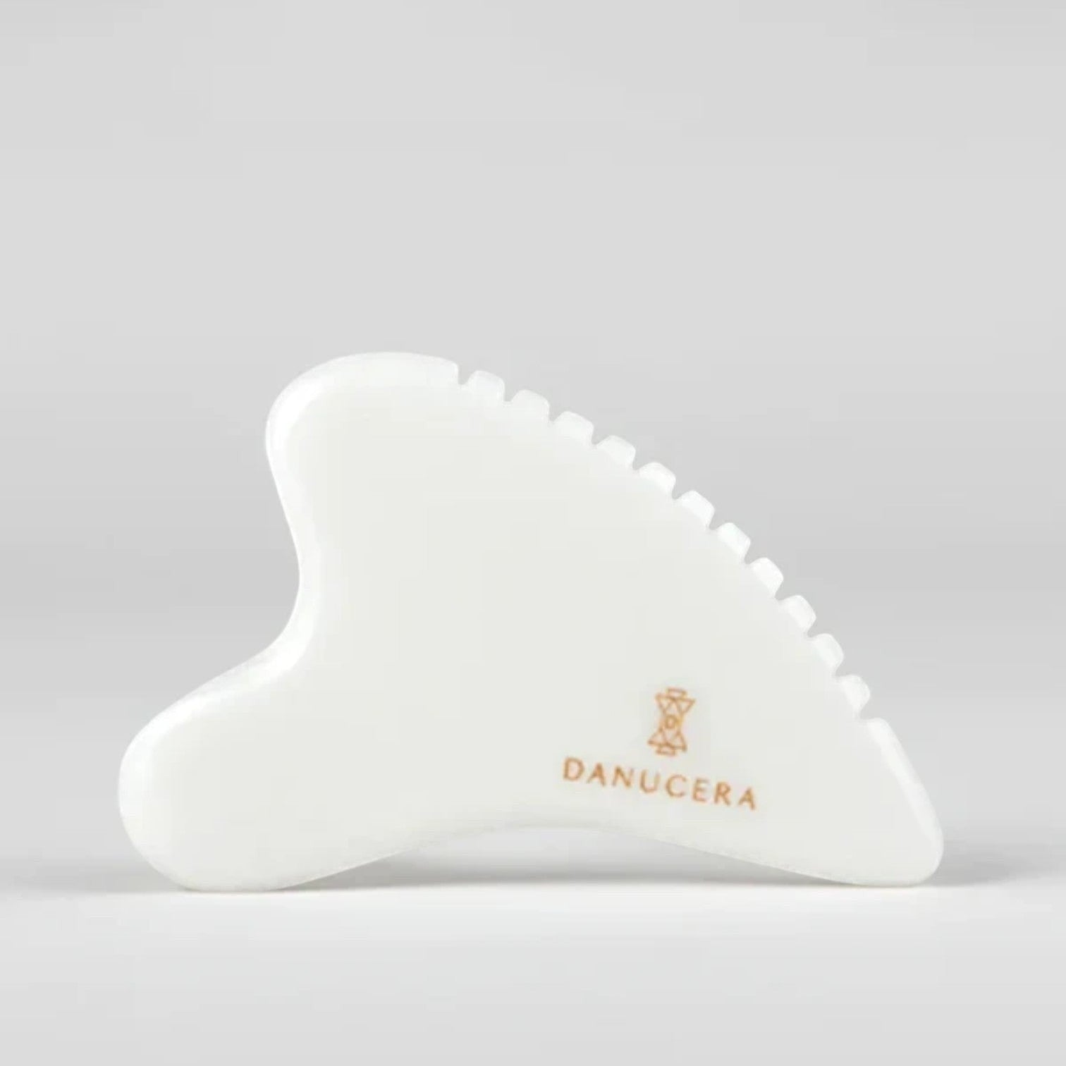 Shop Rescue Spa DANUCERA Sculpting Stone made of white jade for facial massage, lifting, and toning.