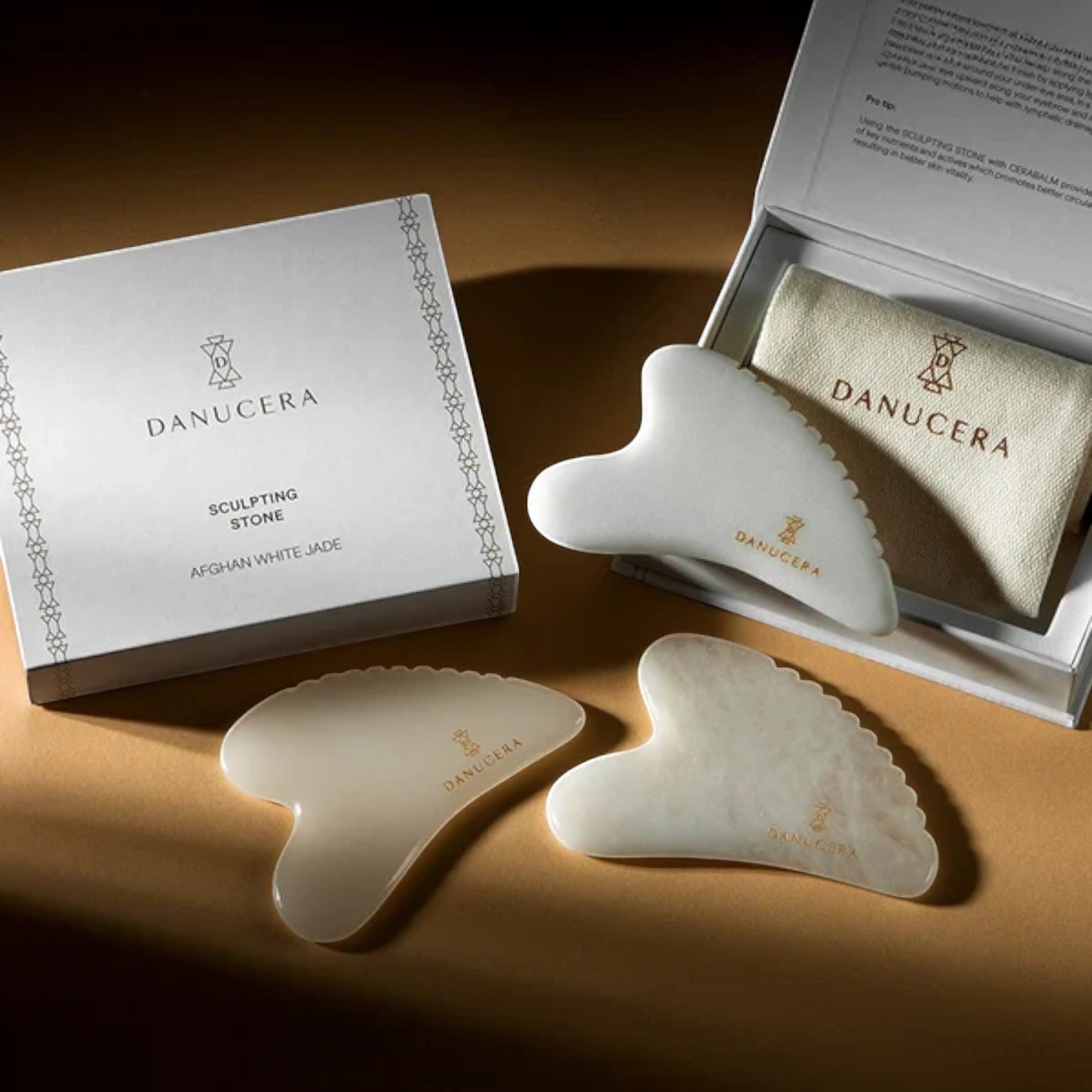 Shop Rescue Spa DANUCERA Sculpting Stone set made of natural white jade for facial massage, lifting, and toning.