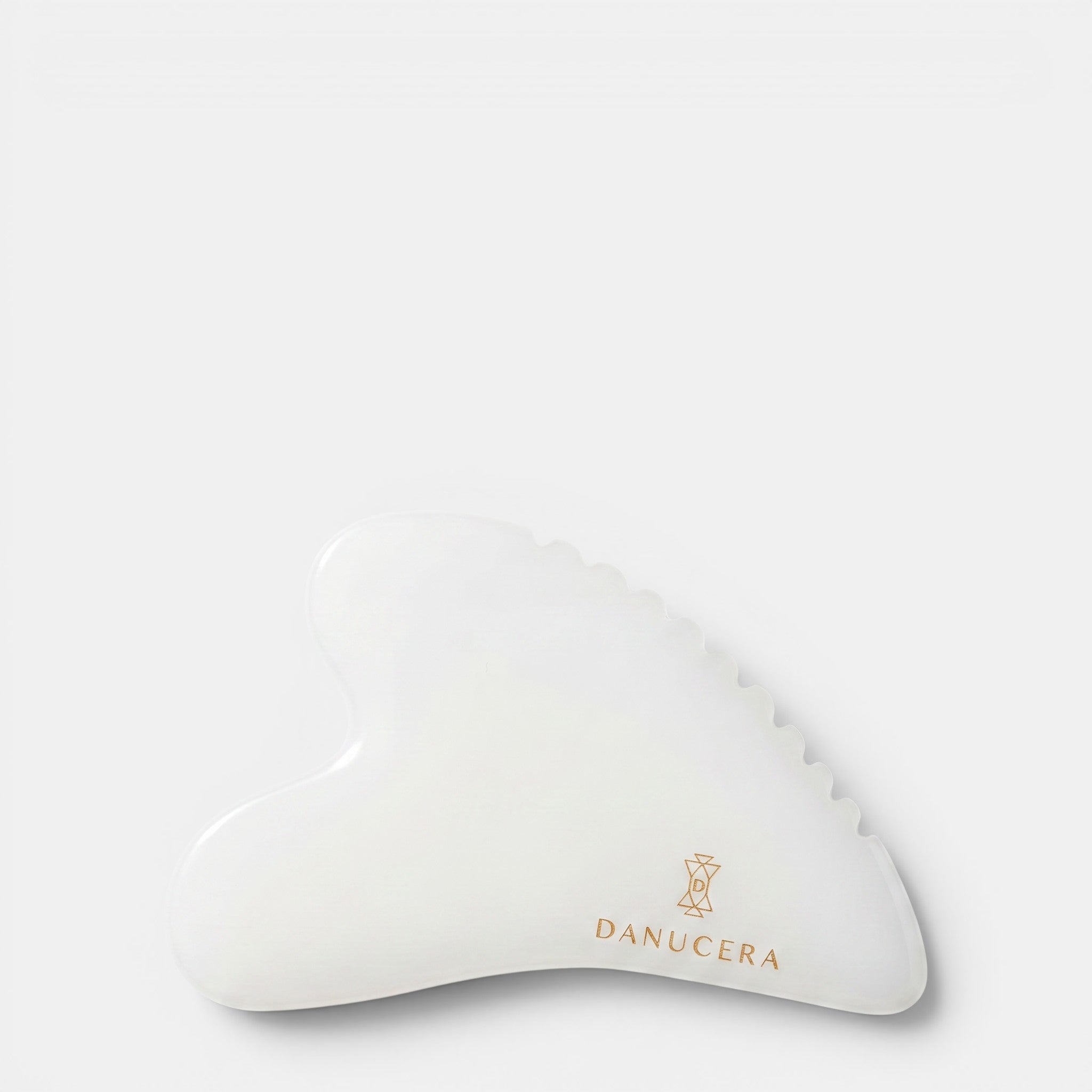 Shop Rescue Spa DANUCERA Sculpting Stone made of white jade for facial massage, lifting, and toning.