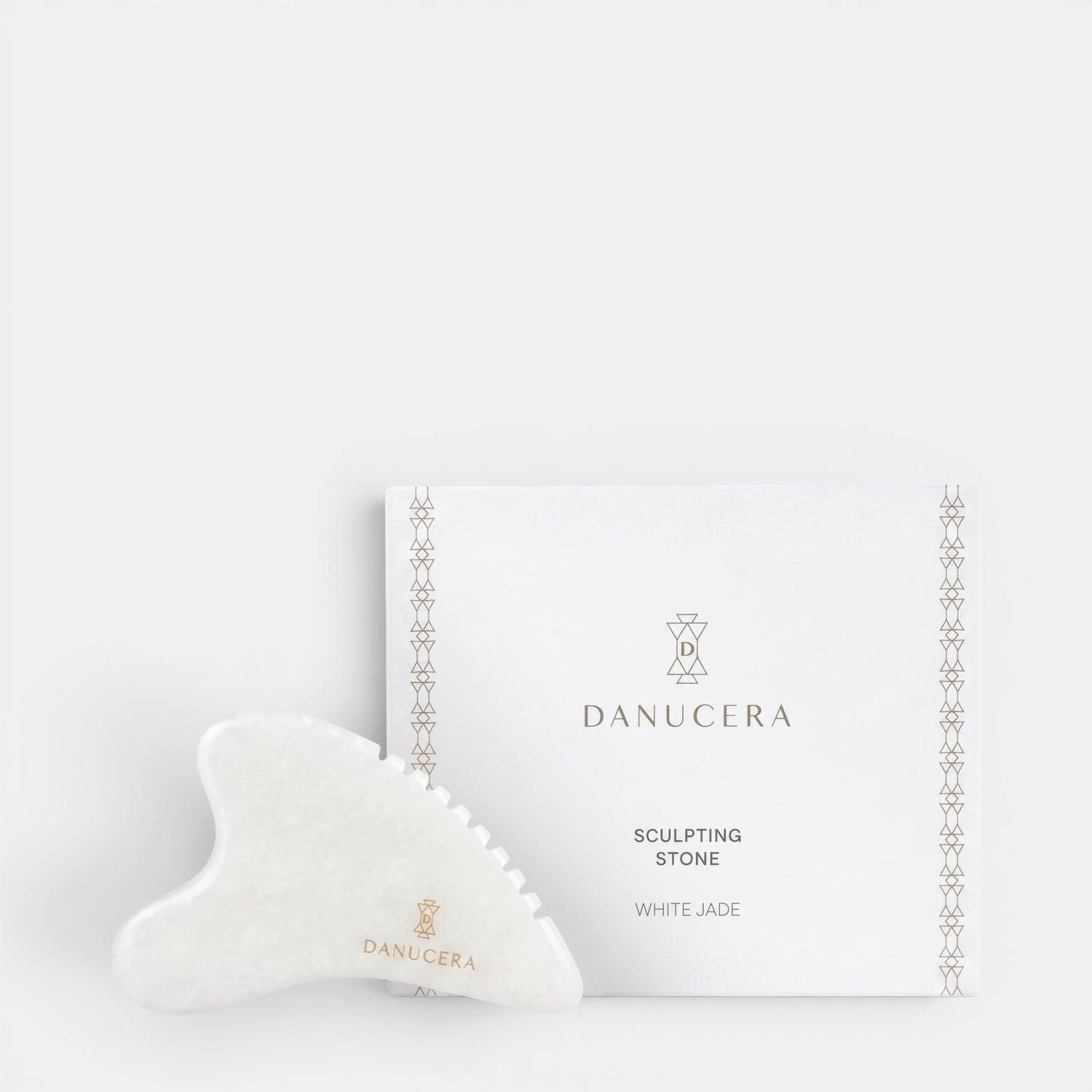 Shop Rescue Spa DANUCERA Sculpting Stone made of white jade for facial massage, shown with its branded white box.
