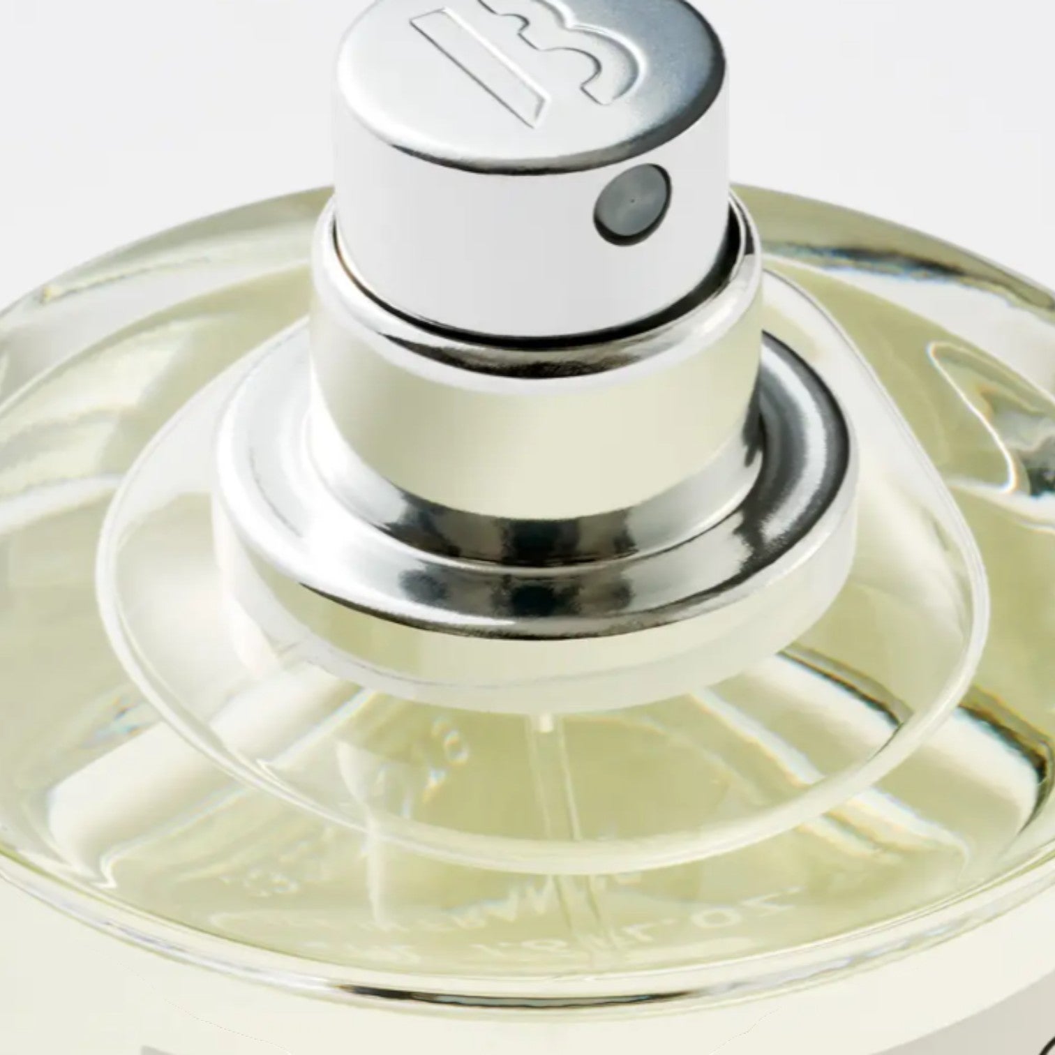 Shop Rescue Spa De Los Santos Eau De Parfum, a clear glass bottle with a silver spray nozzle and a light yellow liquid.