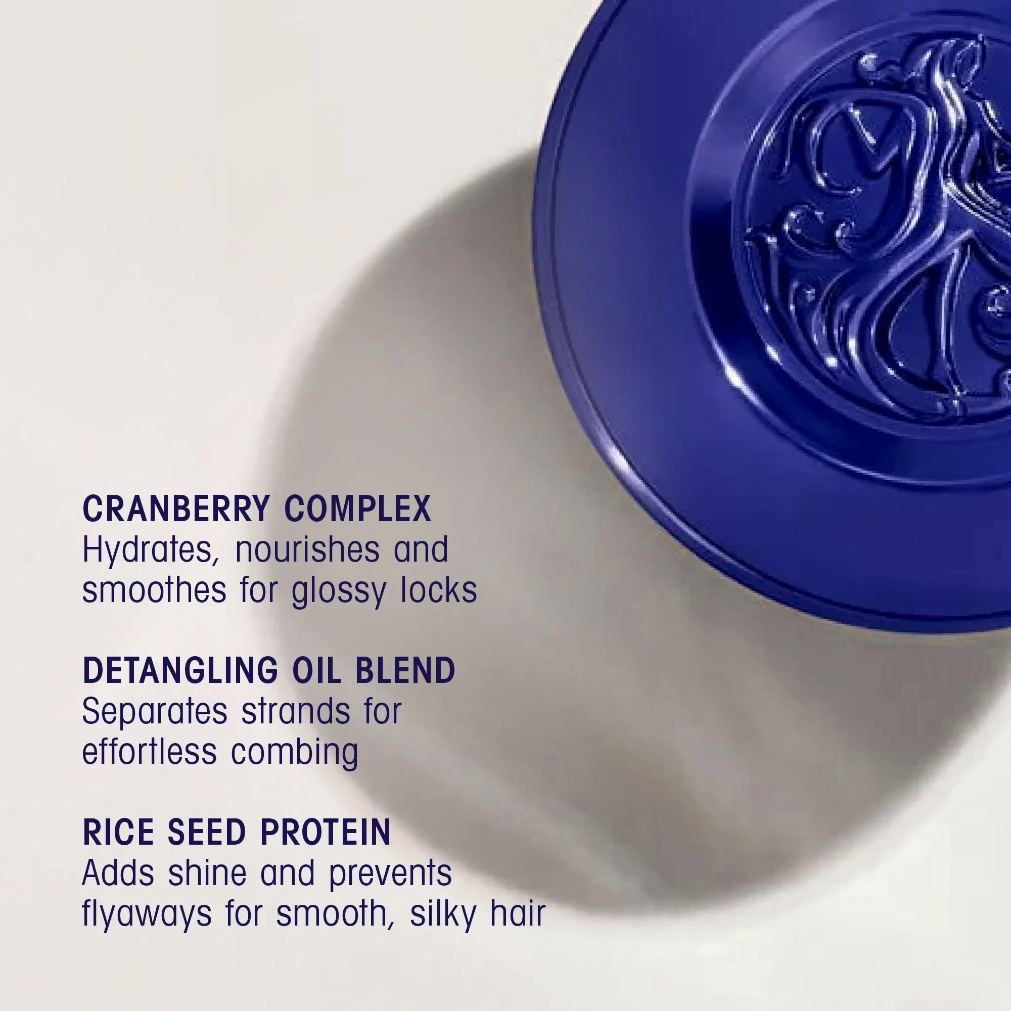 Shop Rescue Spa Run-Through Detangling Primer bottle cap highlighting cranberry complex and rice seed protein benefits