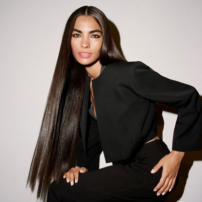Shop Rescue Spa Run-Through Detangling Primer model with long, silky, straight hair in a black blazer