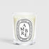 Shop Rescue Spa Diptyque Ambre scented candle in a clear glass vessel with a signature oval label