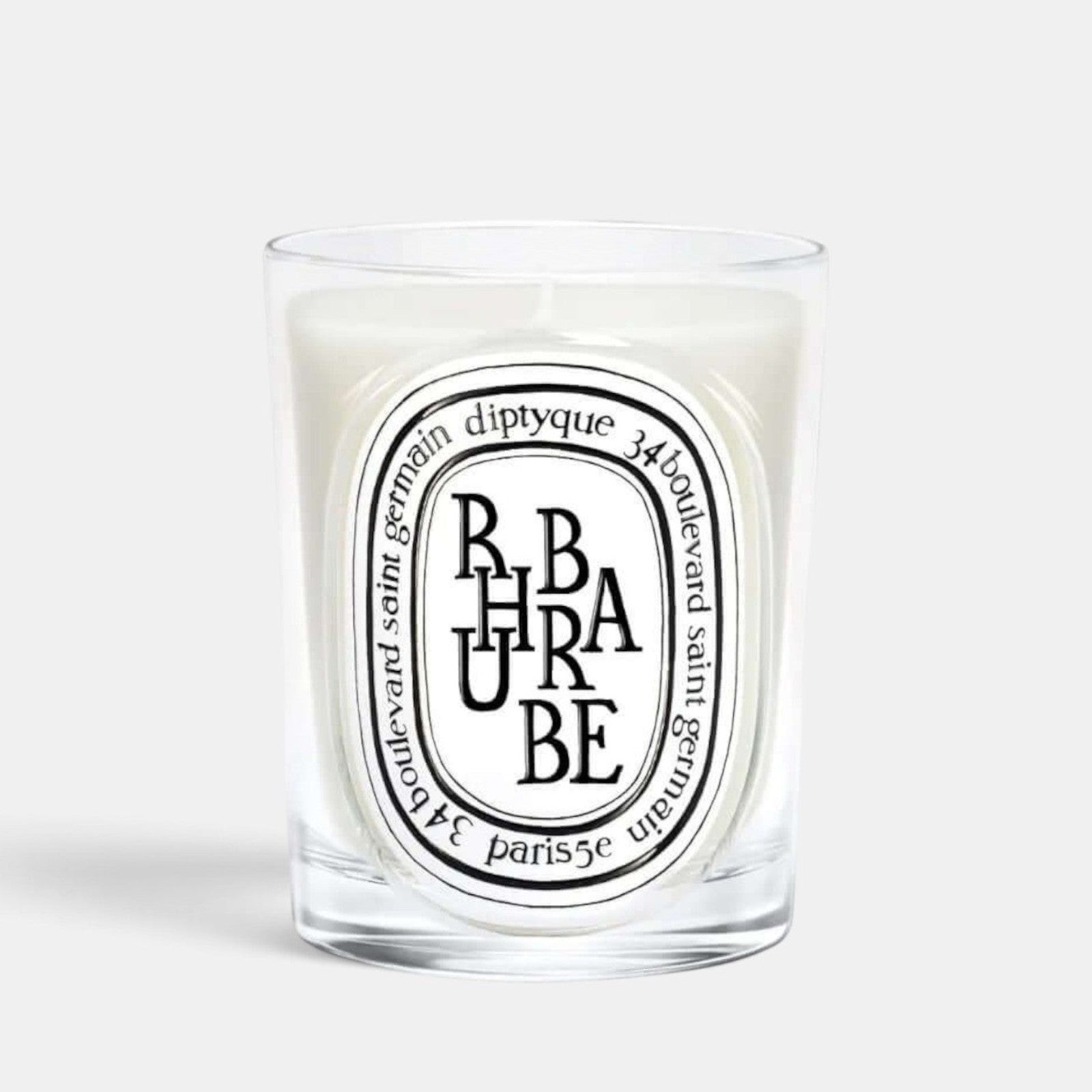 Shop Rescue Spa Diptyque Rhubarbe scented candle in a clear glass vessel with a signature oval label