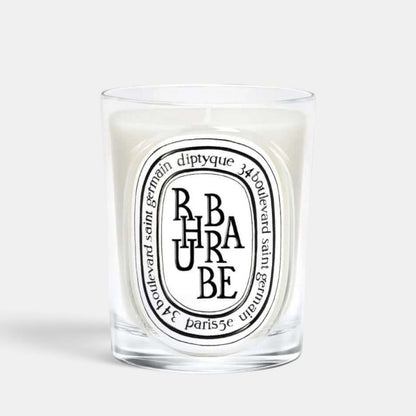 Shop Rescue Spa Diptyque Rhubarbe scented candle in a clear glass vessel with a signature oval label